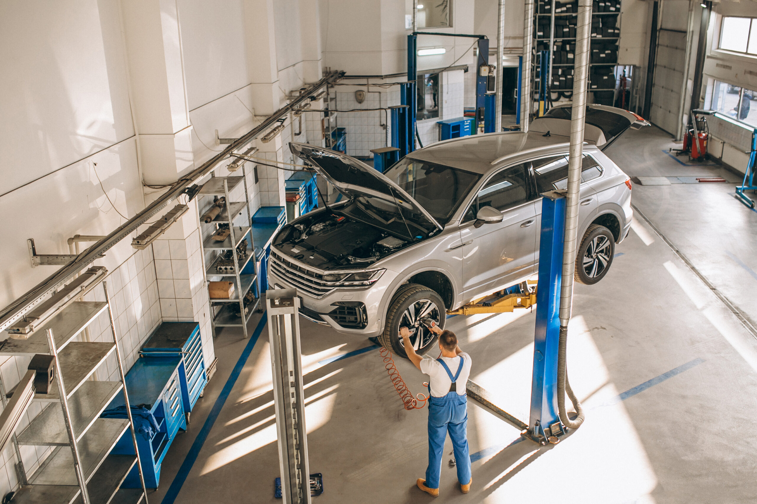 Auto mechanic checking car Auto mechanic checking car